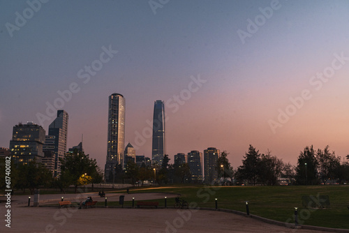 pink sky sunset in a park viewing the skyline of santiago de chile