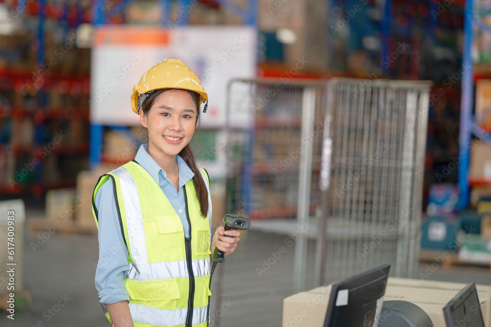 A female manager is checking inventory inside a warehouse. A female manager is checking inventory inside a warehouse.