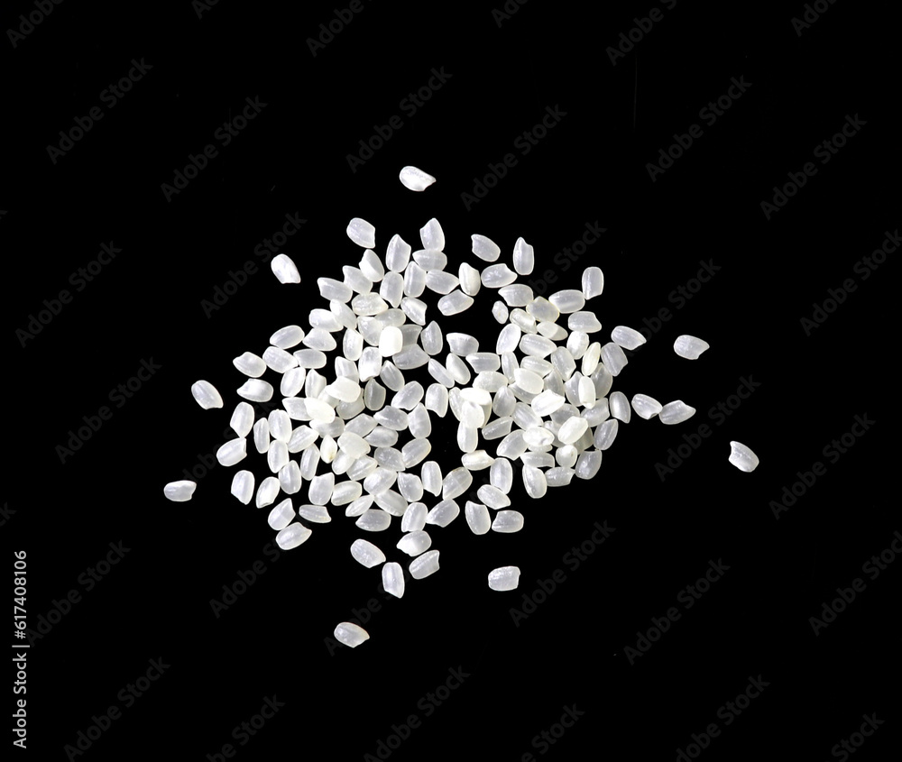 Heaps of uncooked Japanese short grain rice piled together isolated on black background.
Heaps of uncooked Japanese short grain rice piled together isolated on black background.