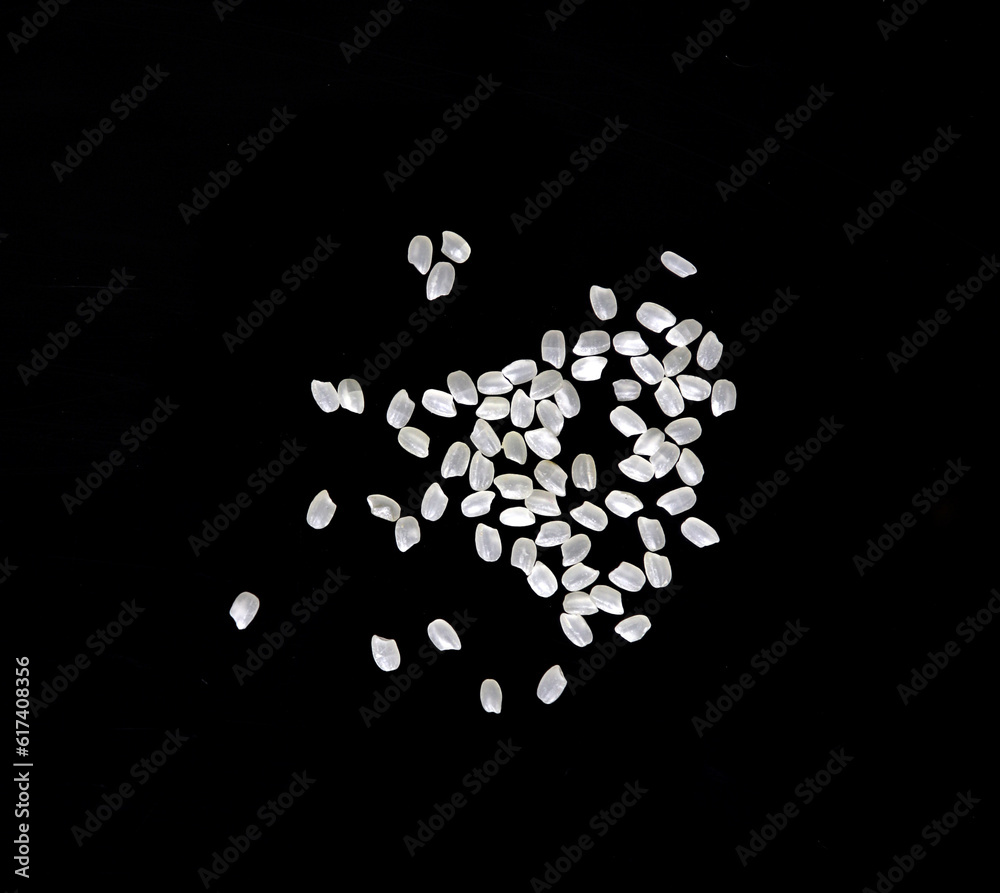 Heaps of uncooked Japanese short grain rice piled together isolated on black background.
Heaps of uncooked Japanese short grain rice piled together isolated on black background.