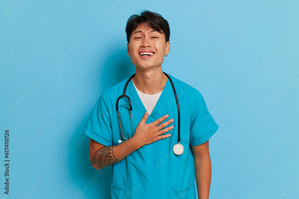 A Young Doctor Poses With A Stethoscope In Uniform Outdoor Stock Photo -  Download Image Now - iStock