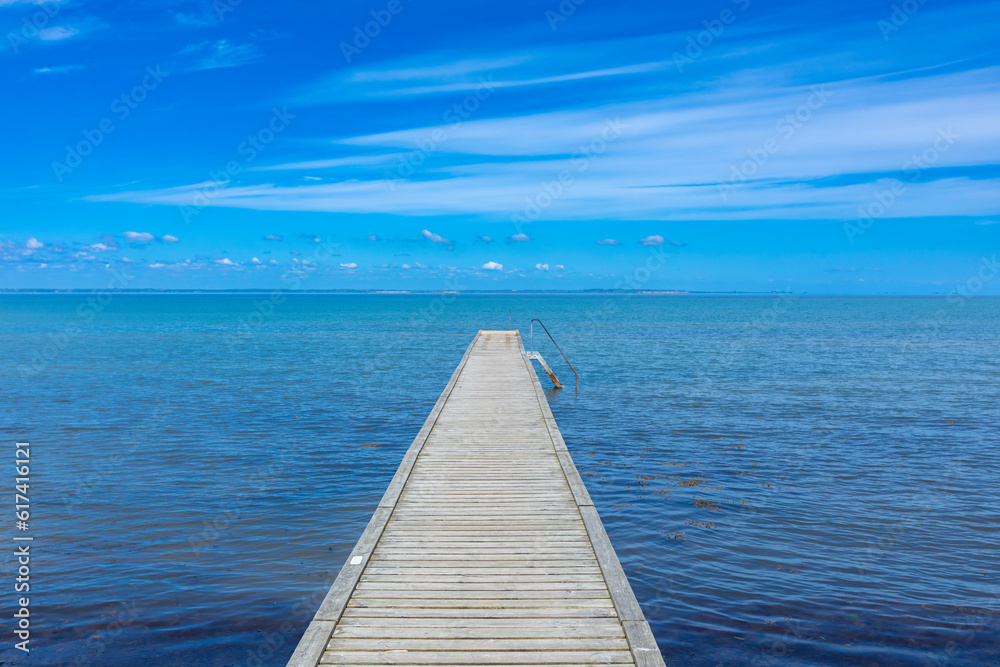 Wooden bathing pier into the Baltic Sea on the island of Als, Denmark Wooden bathing pier into the Baltic Sea on the island of Als, Denmark