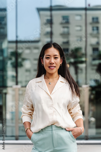 Portrait of young asian business woman outside office building in the corporate city Free Download Portrait of young asian business woman outside office building in the corporate city - GFXLoad