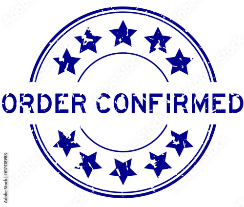 Grunge blue order confirmed word with star icon round rubber seal stamp on white background