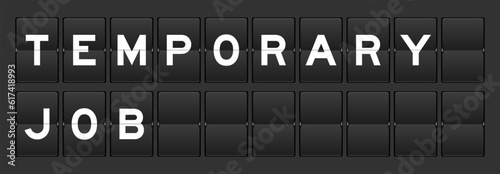 Black color analog flip board with word temporary job on gray background