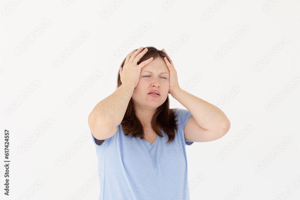 Exhausted pregnant woman touching her head with eyes closed. Female exchange worker suffering from unbearable headache. Health concept