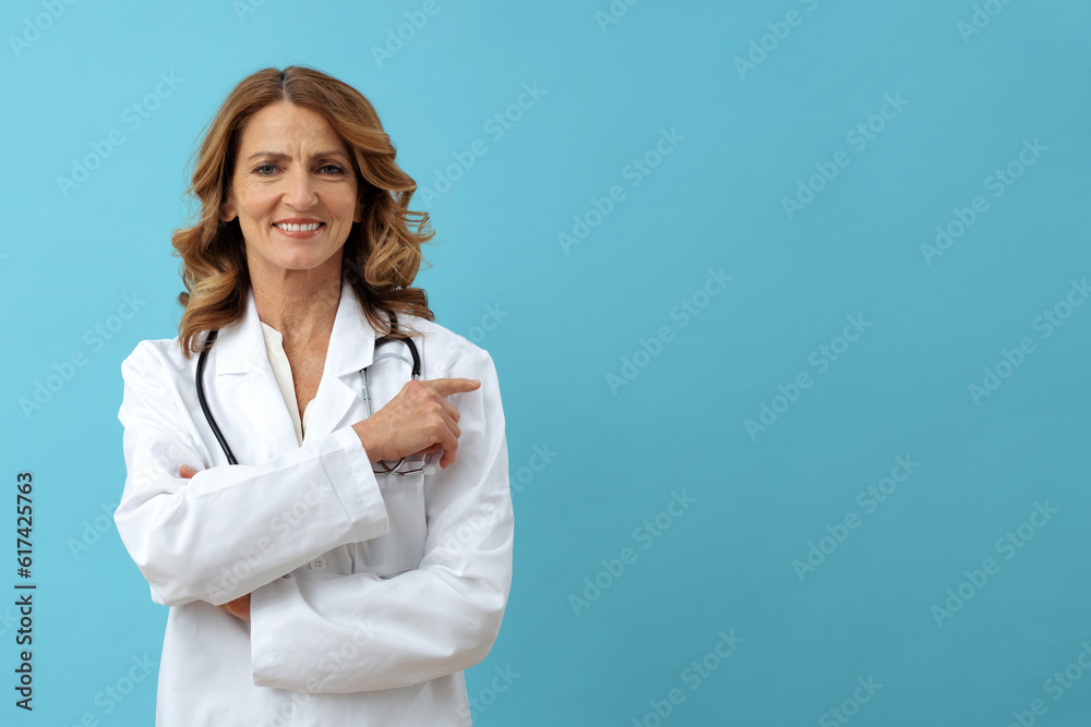 female medic pointing finger to the side, away, copy space, smiling female medic pointing finger to the side, away, copy space, smiling