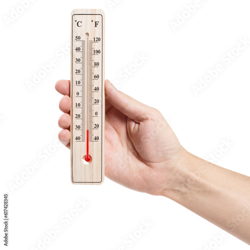 Hand holding thermometer showing low temperature, cut out photo