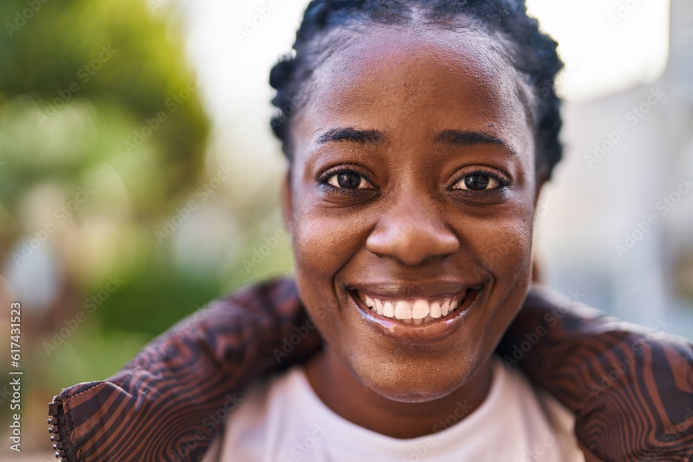 African american woman smiling confident standing at park