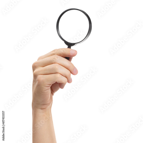 Hand holding a magnifying glass, cut out