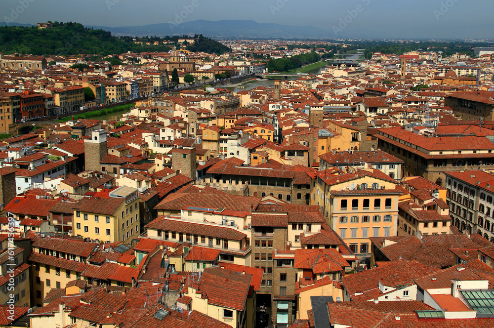 Panoramic view of part of the historic city center of Florence (Firenze) with the Arno river and bridges over it in the Tuscany region of Italy