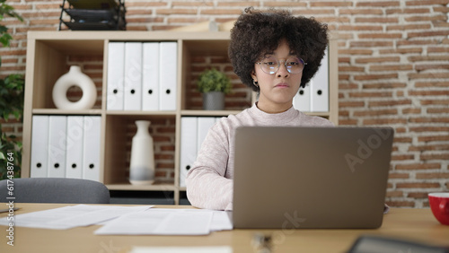 Young african american woman business worker using laptop working at office