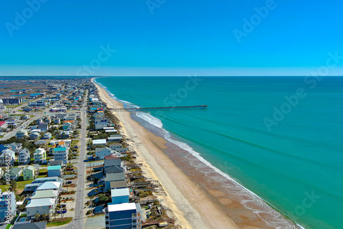 Distant aerial photo of the Surf City fishing pier. 