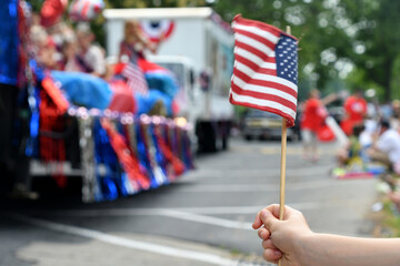 Waving an American flag at the Independence Day Parade on the 4th of July