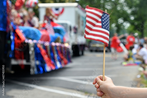 Waving an American flag at the Independence Day Parade on the 4th of July