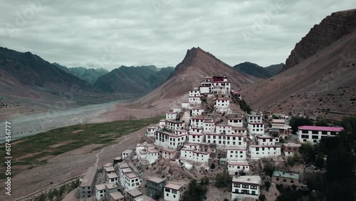 Aerial View of Key monastery or kee gompa with mountains in the background and birds flying in Kaza spiti himachal pradesh India