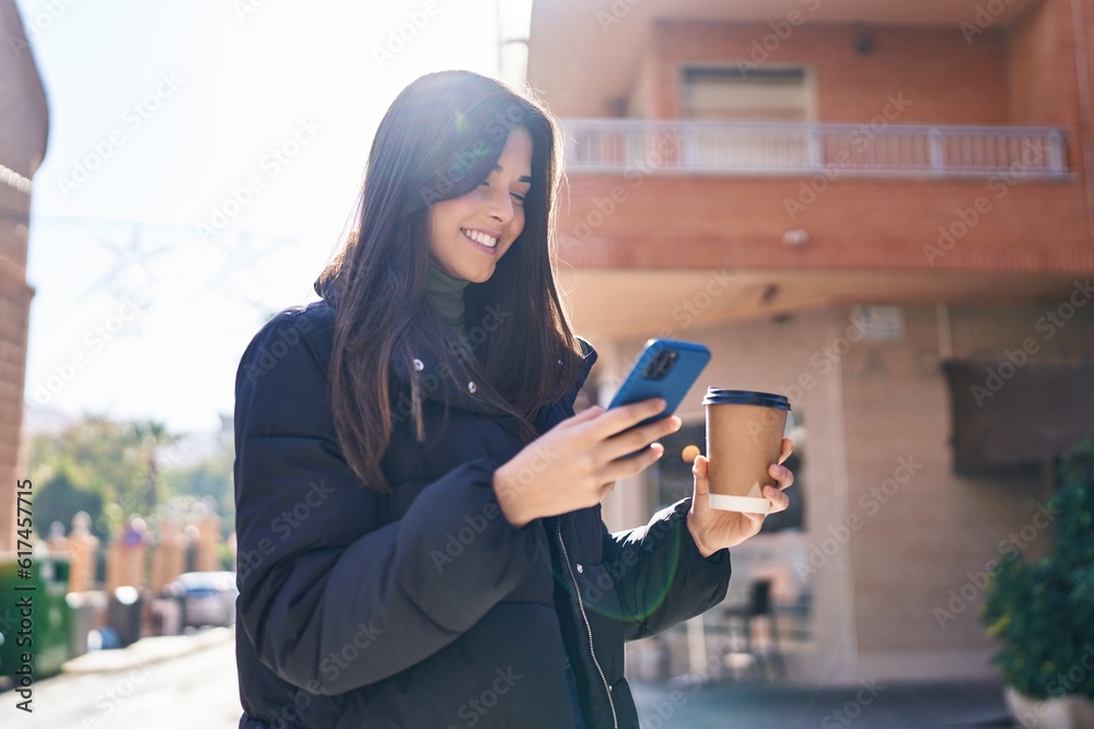 Young beautiful hispanic woman smiling confident using smartphone at street Young beautiful hispanic woman smiling confident using smartphone at street