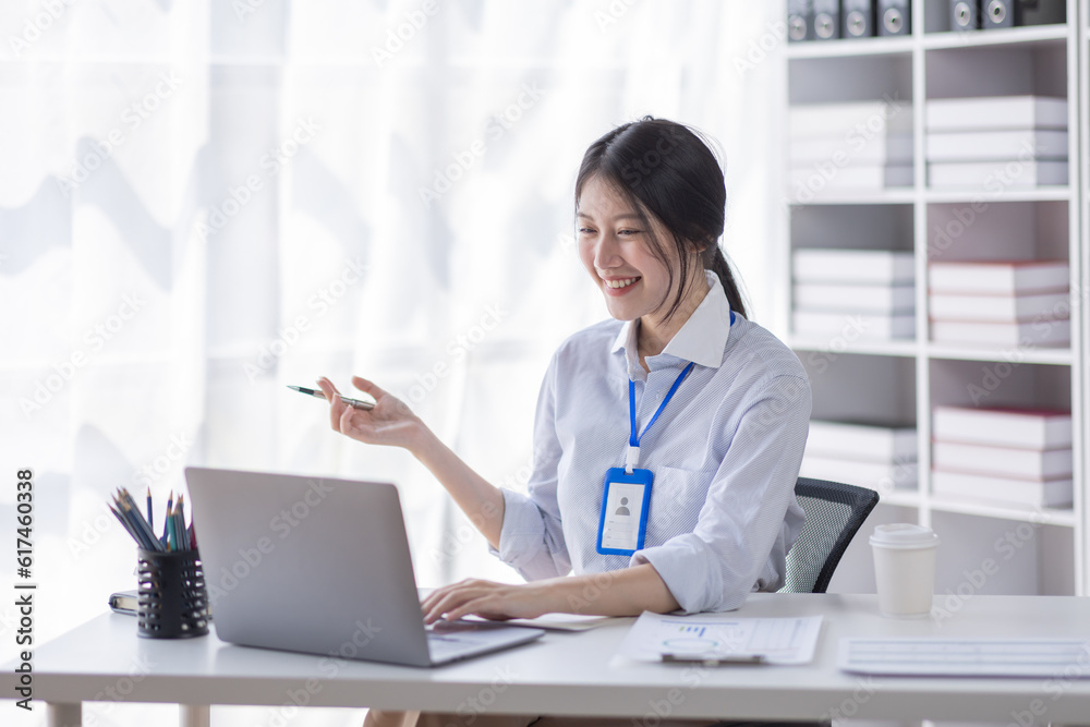 Business Asian woman work documents on laptop computer at office with calculator accounting on desk, do planning analyzing the financial report, business plan investment, finance analysis concept. Business Asian woman work documents on laptop computer at office with calculator accounting on desk, do planning analyzing the financial report, business plan investment, finance analysis concept.