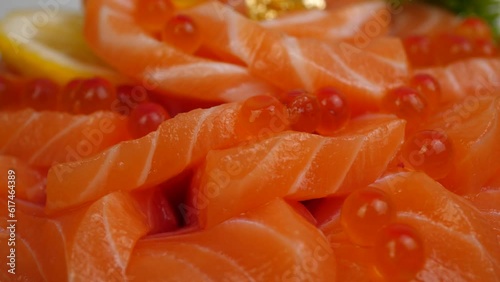 Sashimi salmon decoration plate delivery.
Cake salmon roe Japanese food turn plate.  top view