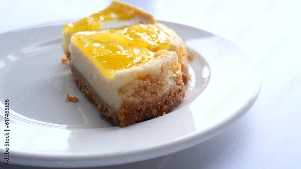  half eaten a slice of cheese cake 