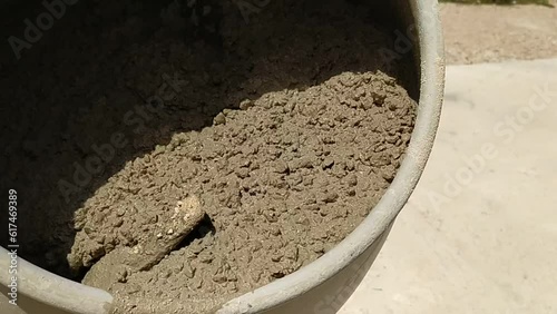 Powerful Mixing: Close Up of Cement Mixer Mixing Concrete.