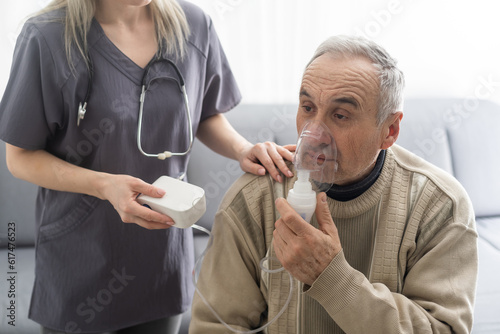 Tableau sur toile Elderly Senior Man nursing care wear oxygen inhaler device for helping breath respiratory