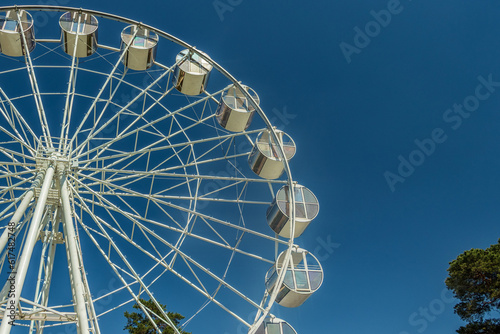 Part of the Ferris wheel against the sky.