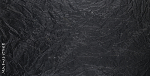 black abstract crumpled canvas background © serikbaib