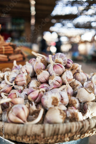  Delicious group of garlic on wicker bowl at street market