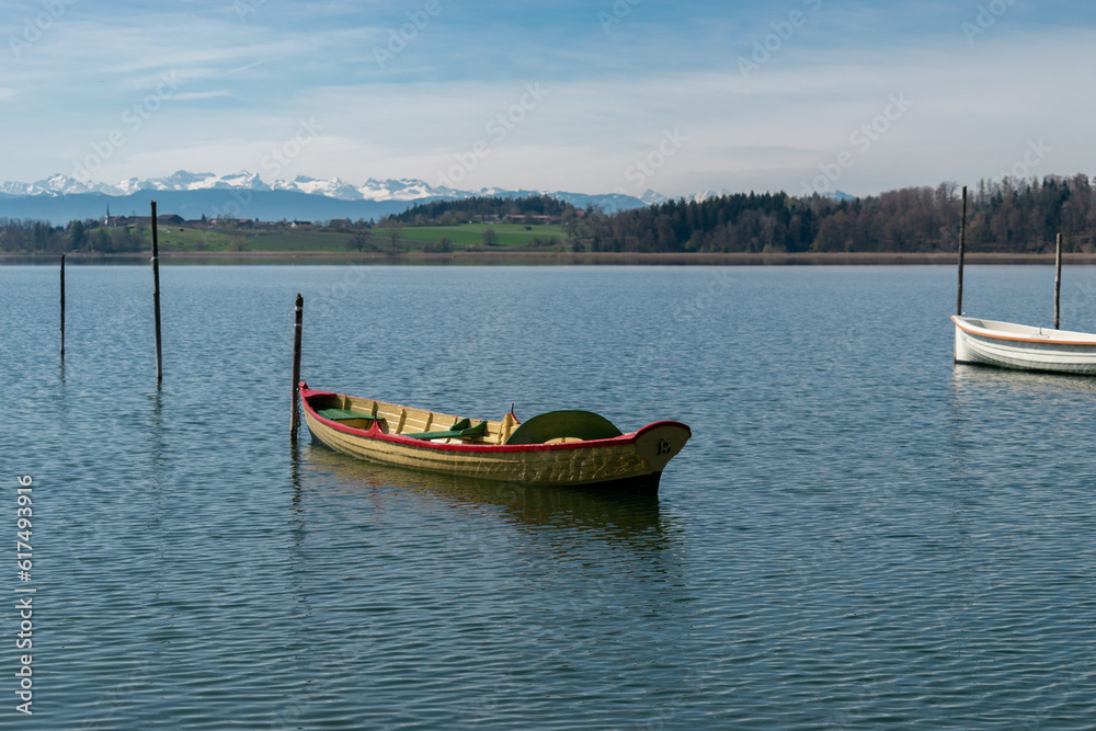 Small boats on the lake Pfaeffikersee in Zurich in Switzerland Small boats on the lake Pfaeffikersee in Zurich in Switzerland