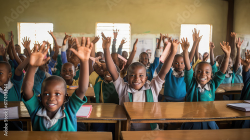 African kids in the classroom raising hands. Back to school
