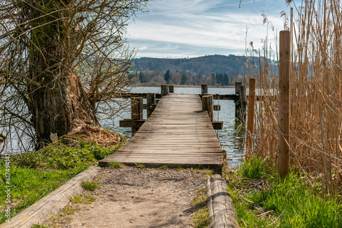 Fototapeta Naklejka Na Ścianę i Meble -  Small pier at the lake Pfaeffikersee in Zurich in Switzerland