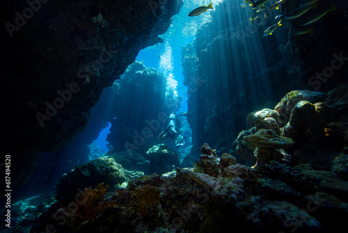 Diver exploring the coral reefs and cave in Egypt.