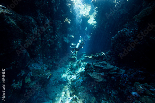 Diver exploring the coral reefs and cave in Egypt.