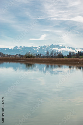 Lake Pfaeffikersee with the mountains in the background in Zurich in Switzerland