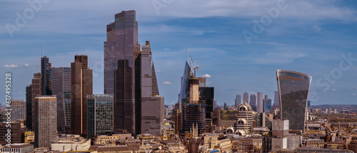 Panoramic aerial city scape about London city with skyscapers. Amazing sunny day with a bit cloudy sky. 