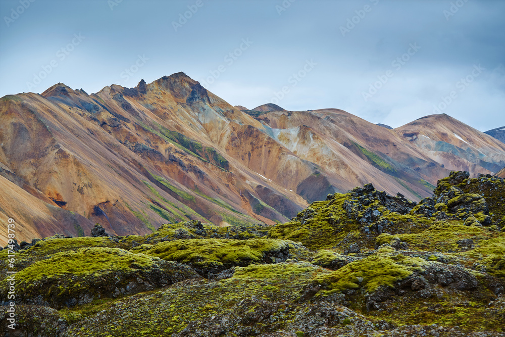 Valley National Park Landmannalaugar. rhyolite mountains and hills covered with moss in a national park in Iceland in August.