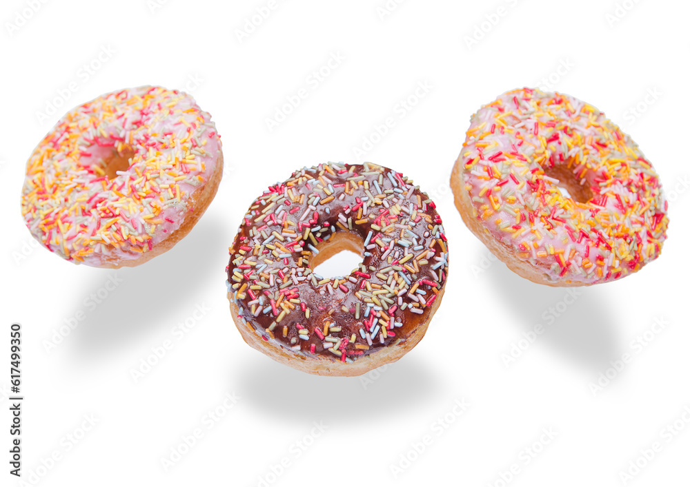 Chocolate and pink donuts in the air for breakfast on white background Chocolate and pink donuts in the air for breakfast on white background