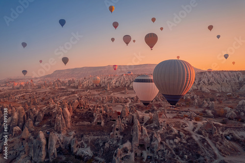 Romantic vacation Goreme national park, color hot air balloons fly, Amazing sunrise Cappadocia. Turkey travel Concept, aerial view