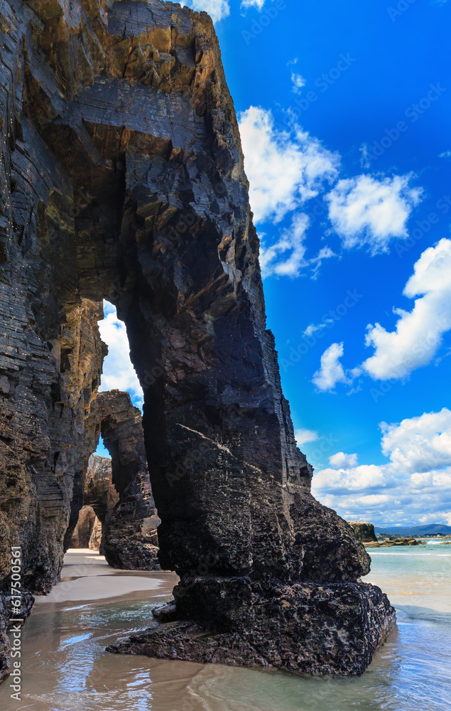 Natural rock arches on Cathedrals beach  in low tide (Cantabric coast, Lugo, Galicia, Spain).