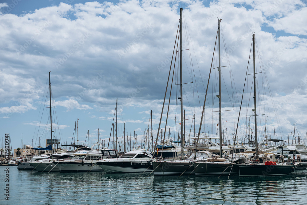 Alicante, Spain - May 16, 2023: Summer Costa Blanca, Alicante  - modern yachts, boats  moored in the city marina. Trip concept. popular Spanish city.  part of the city center