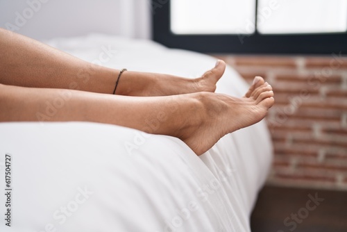 Young caucasian woman lying on bed at bedroom