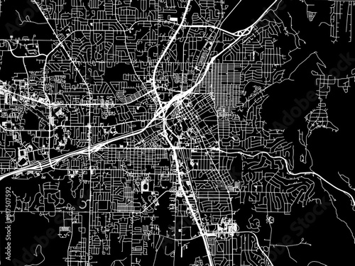 Vector road map of the city of  Huntsville Alabama in the United States of America with white roads on a black background.