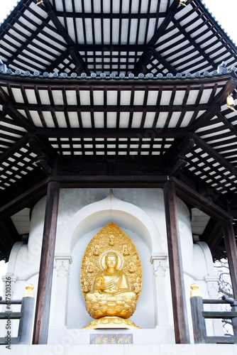 London, England - Feb 2, 2010: The Peace Pagoda in Battersea Park was a gift to London from the Japanese Buddhist Order Nipponzan Myohoji in 1985. photo