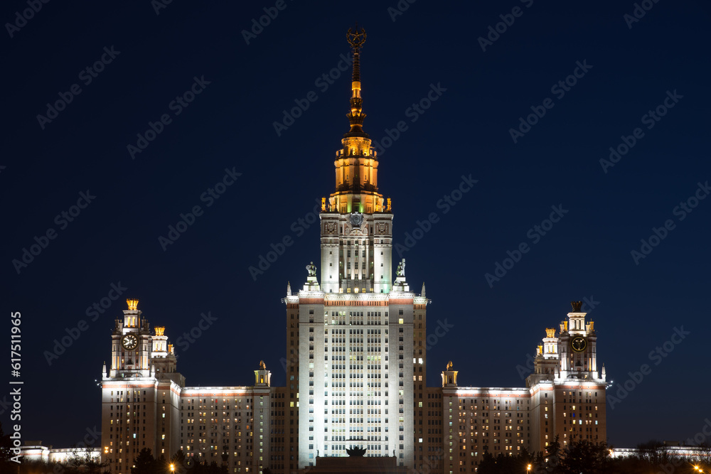 Night city lights. Main building of the Lomonosov Moscow State University - MSU. It is one of the Seven Sisters - a group of seven skyscrapers in Moscow designed in the Stalinist style. Night city lights. Main building of the Lomonosov Moscow State University - MSU. It is one of the Seven Sisters - a group of seven skyscrapers in Moscow designed in the Stalinist style.