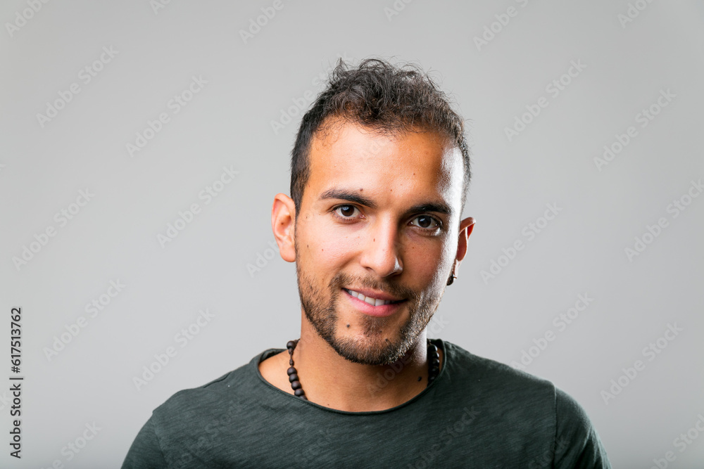 Obraz premium studio shot (portrait) of a latin-american handsome young man that appears not too model-like but natural