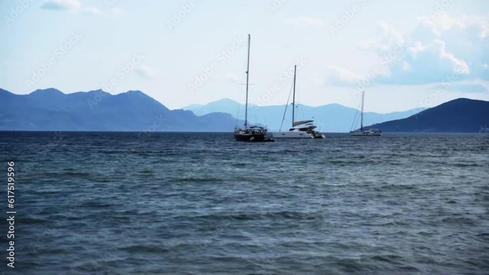 Experience the dynamic motion of boats on the waves through a captivating time-lapse video, showcasing their rhythmic movement throughout the day. Experience the dynamic motion of boats on the waves through a captivating time-lapse video, showcasing their rhythmic movement throughout the day.