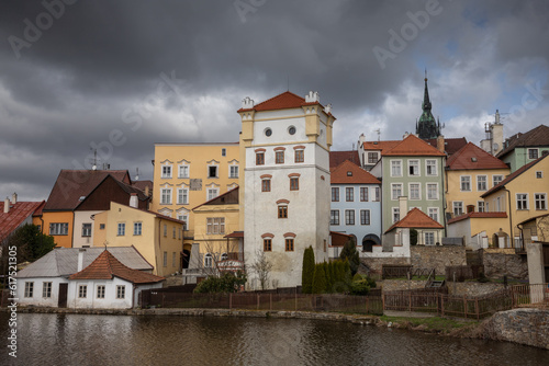 Historic houses in the center of Jindřichův Hradec on the bank of the pond