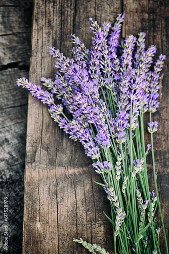 Fresh lavender over wooden background. Summer floral background with lavender flowers and wood.