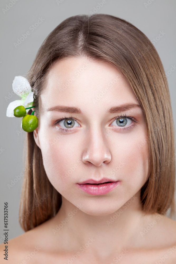 Beautiful brunette woman with a white flower in hair Beautiful brunette woman with a white flower in hair